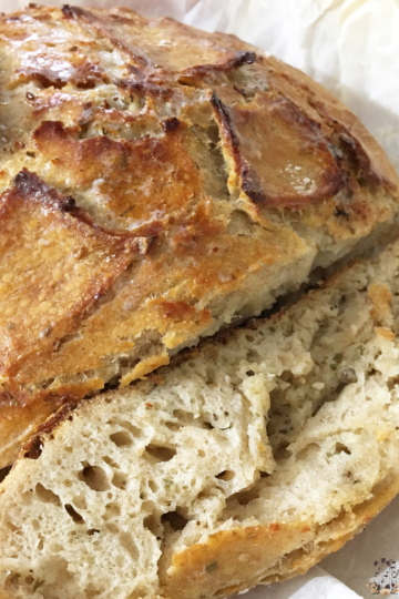Garlic Parmesan Sourdough Bread on parchment paper