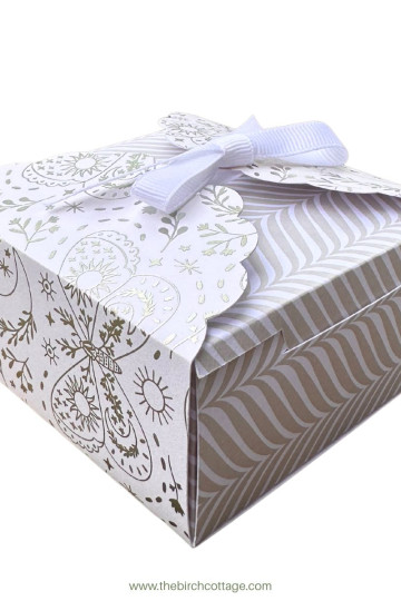 small white gift box with wrap and ribbon closure