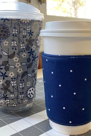 hot and cold Starbucks cups with blue coffee cup sleeves